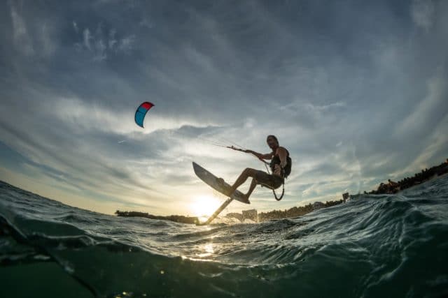 A young while male kite surfing 