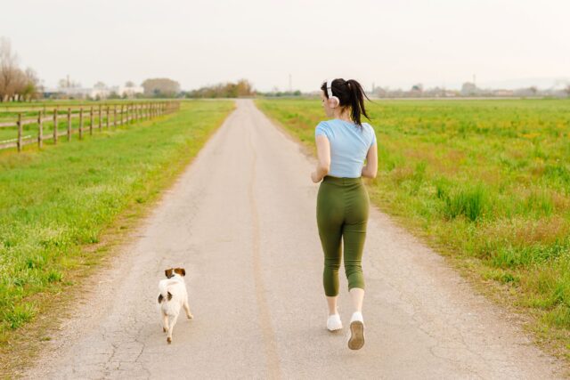 woman-and-dog-running-and-exercising-outdoor-
