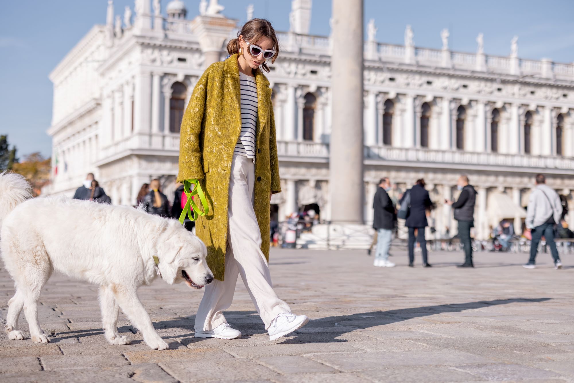 woman-walking-central-square-while-traveling-in-venice-Pet Friendly Destinations