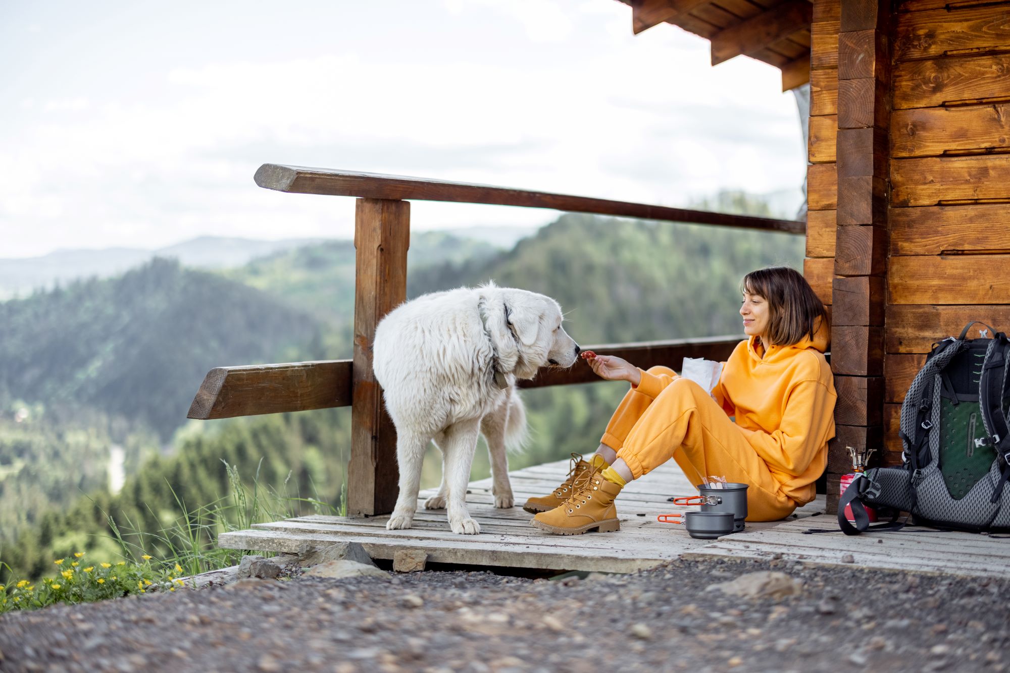 woman-travels-with-dog-in-the-mountains