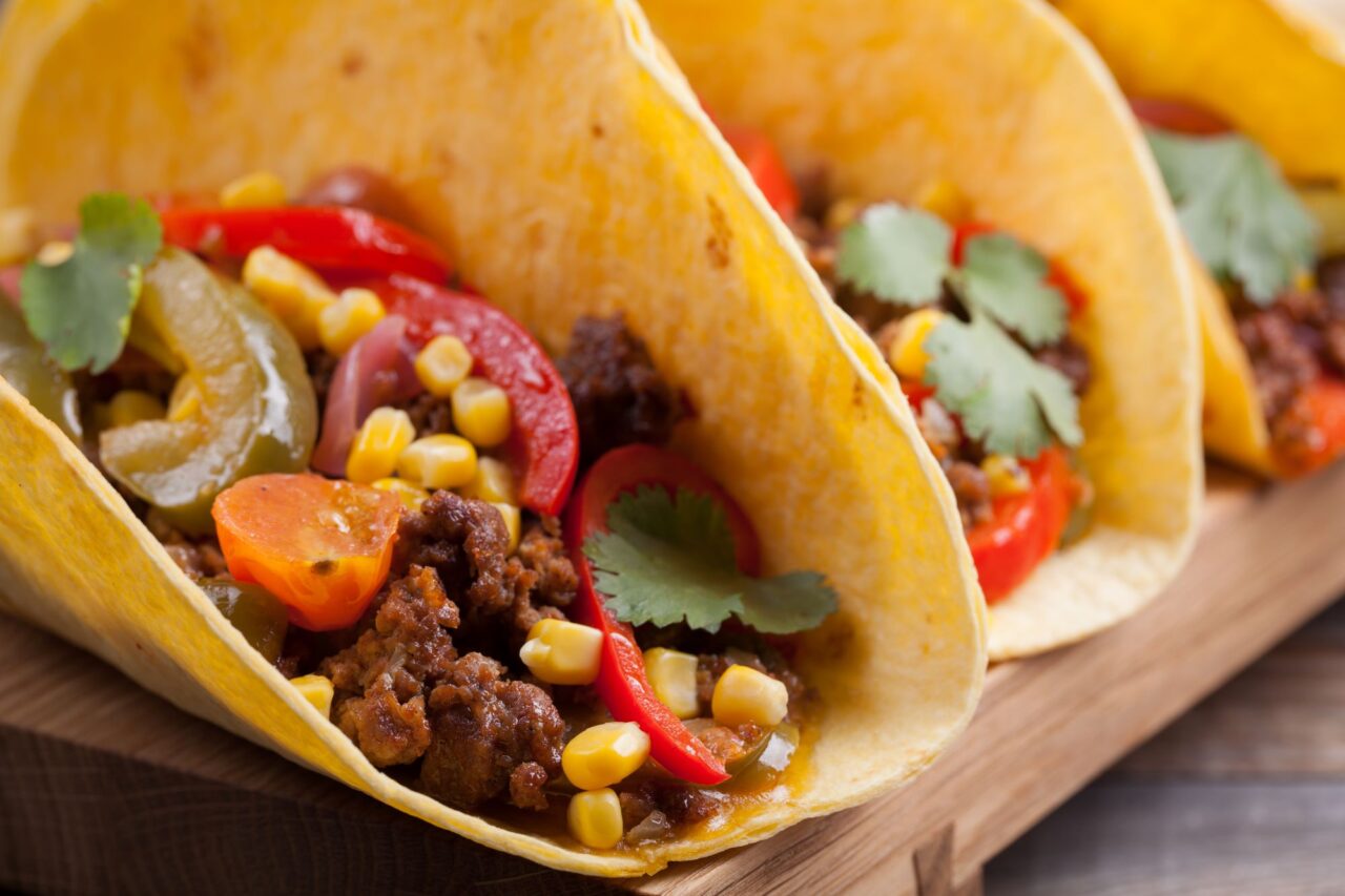 Mexican tacos with minced beef, vegetables and salsa. Tacos al pastor