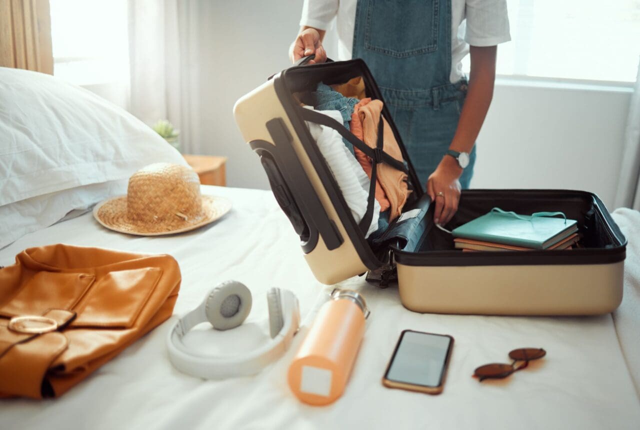 woman and packing clothes, bag and luggage for travel